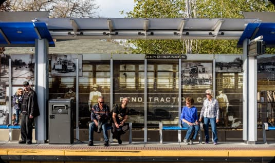 transit station with riders waiting